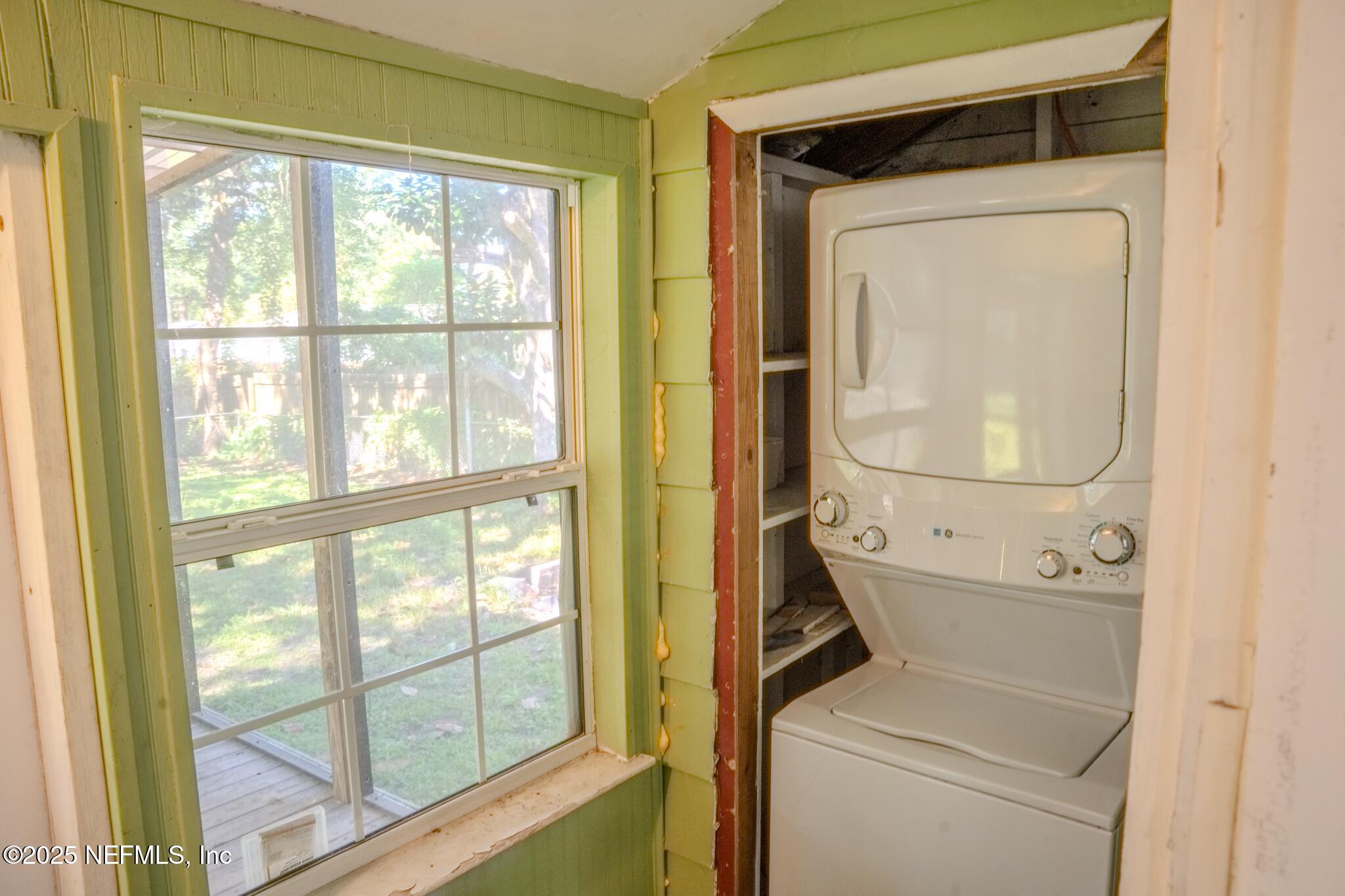 4916 Dundee Road Jacksonville, FL 32210 - Photo 14 of 16 a utility room with dryer and washer