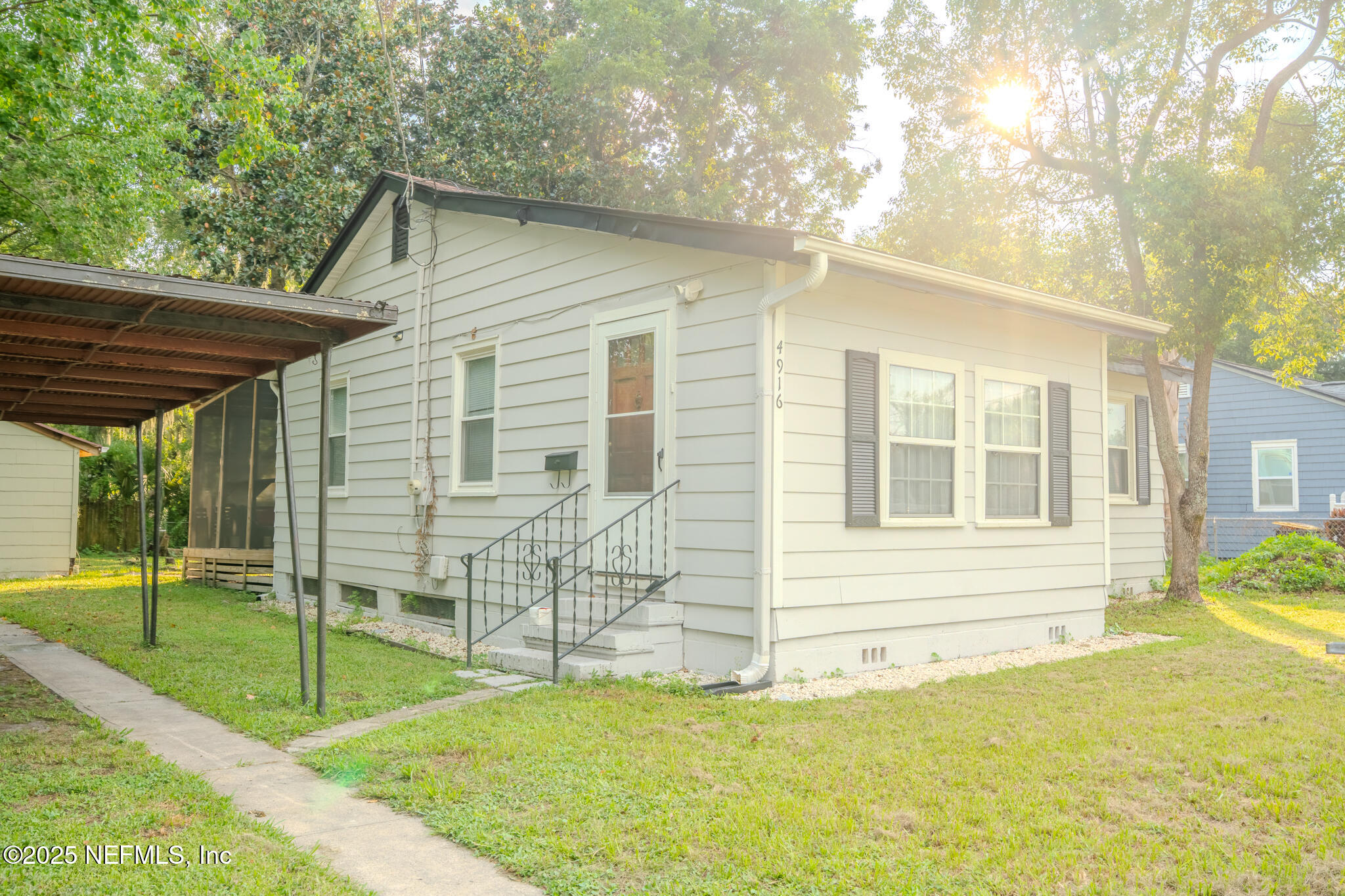 4916 Dundee Road Jacksonville, FL 32210 - Photo 3 of 16 a view of house with backyard