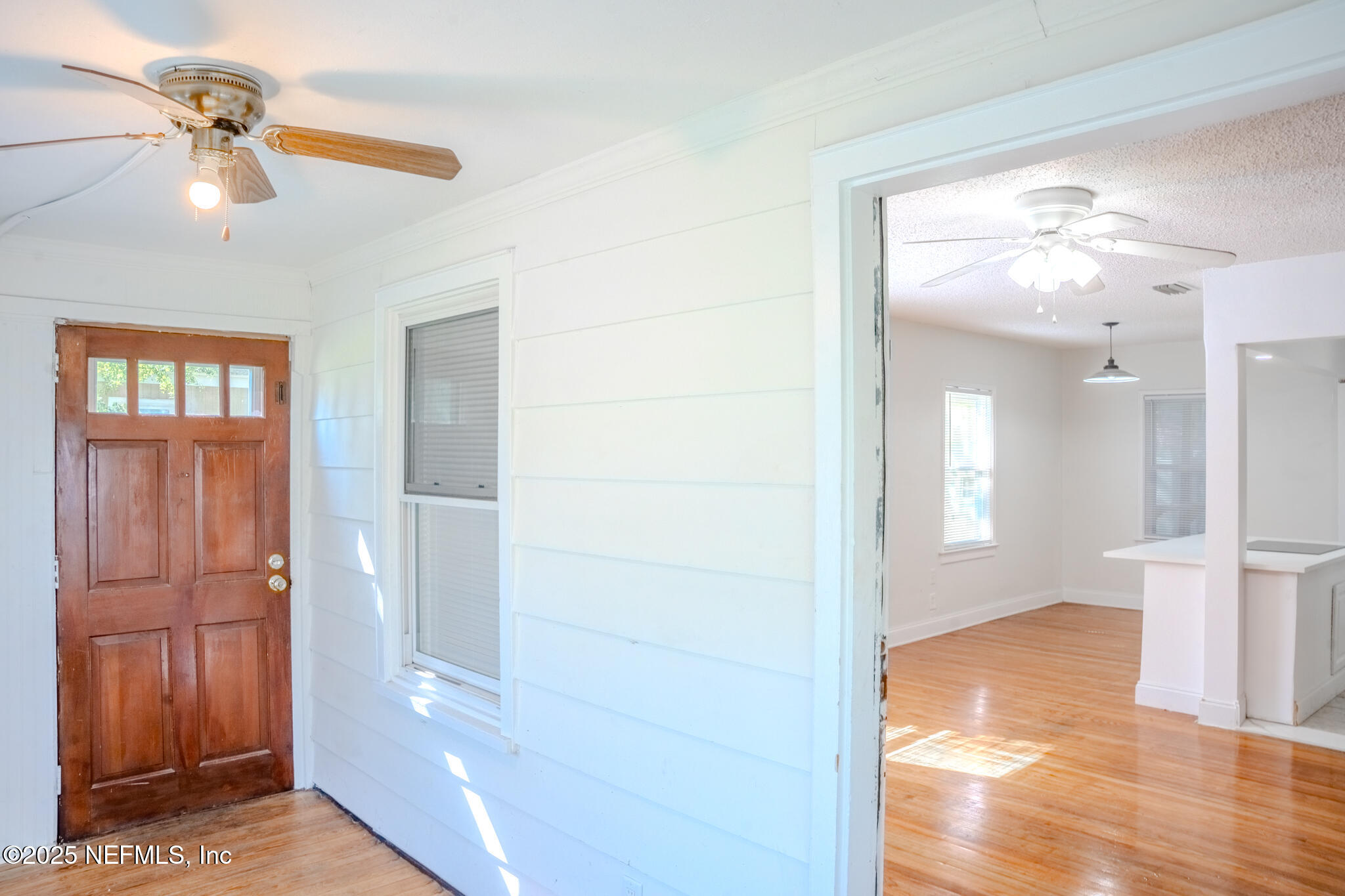 4916 Dundee Road Jacksonville, FL 32210 - Photo 4 of 16 a view of a room with wooden floor and cabinet