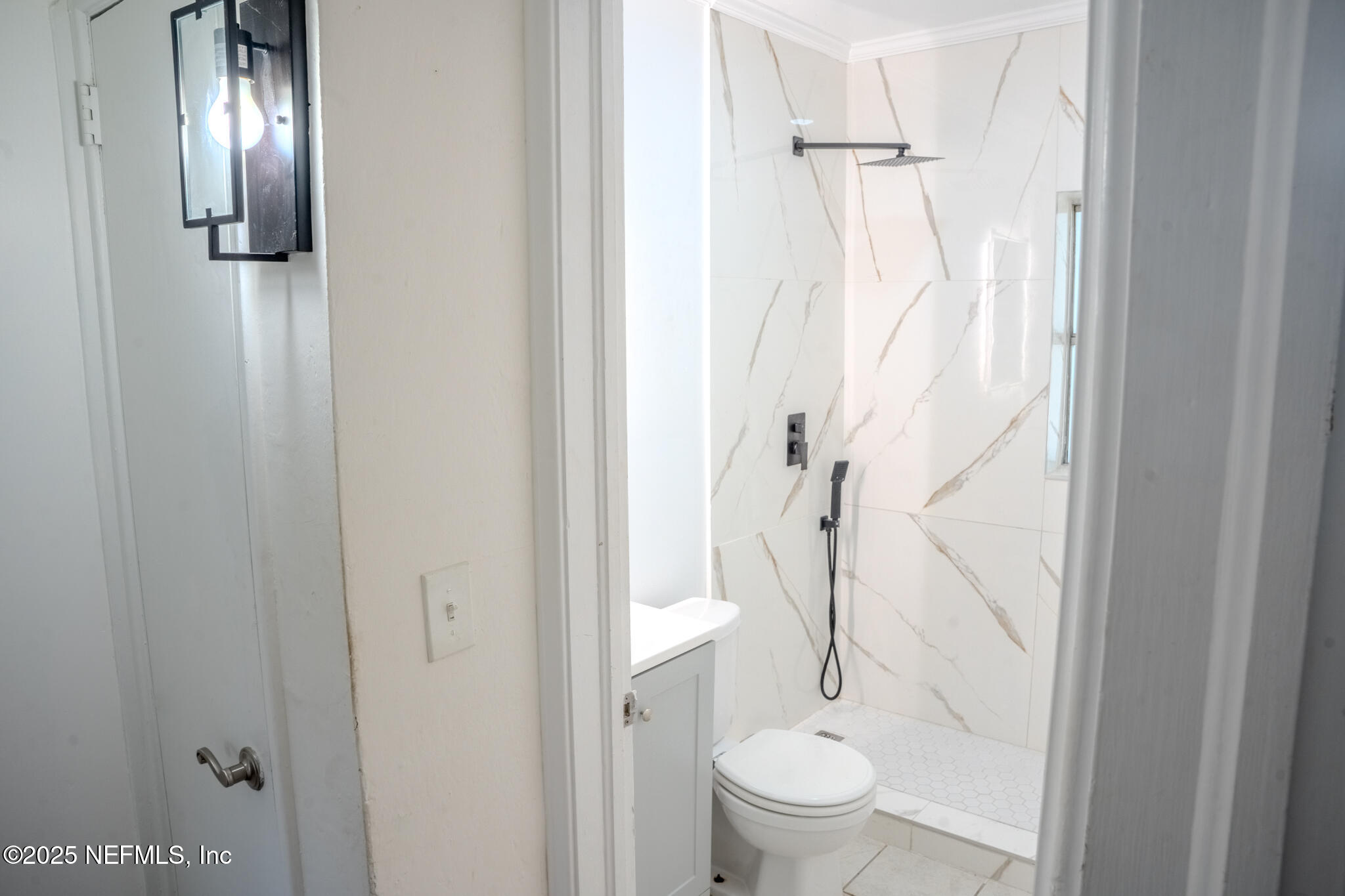 4916 Dundee Road Jacksonville, FL 32210 - Photo 10 of 16 a bathroom with a granite countertop shower a toilet and a sink