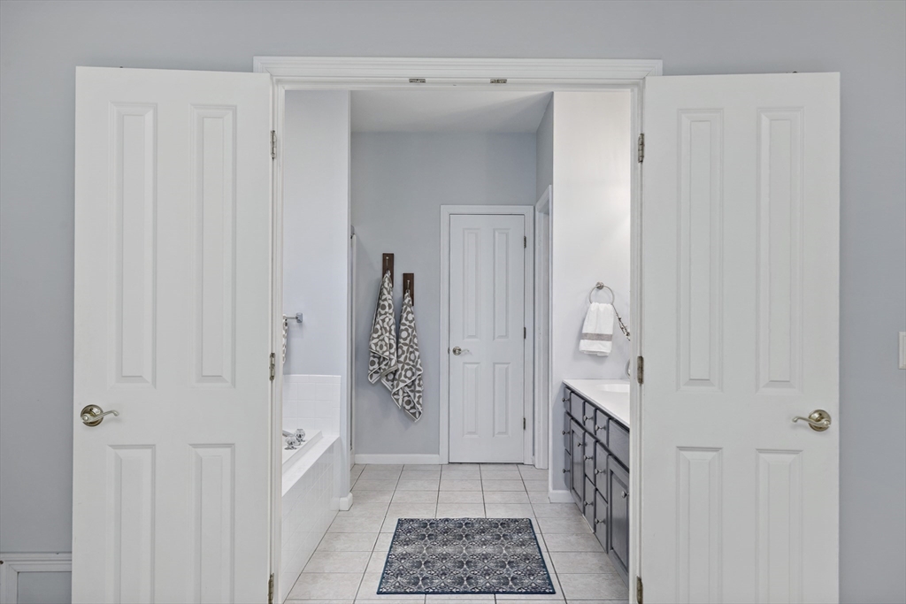 31 Fox Hollow Plymouth, MA 02360 - Photo 12 of 39 a bathroom with a sink and a mirror