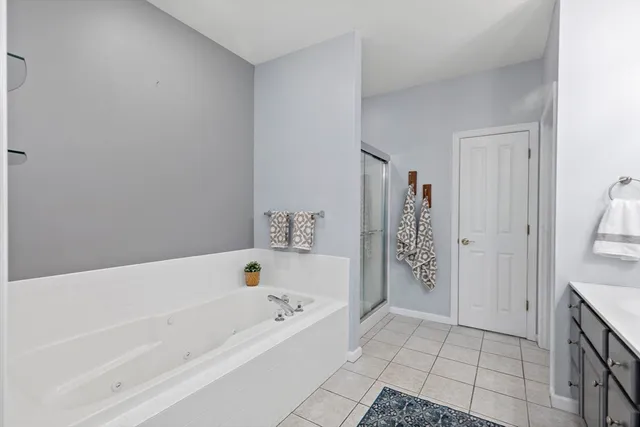 a bathroom with a bathtub and shower