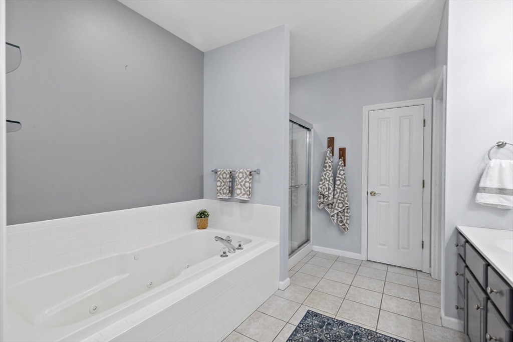 31 Fox Hollow Plymouth, MA 02360 - Photo 14 of 39 a bathroom with a bathtub and shower