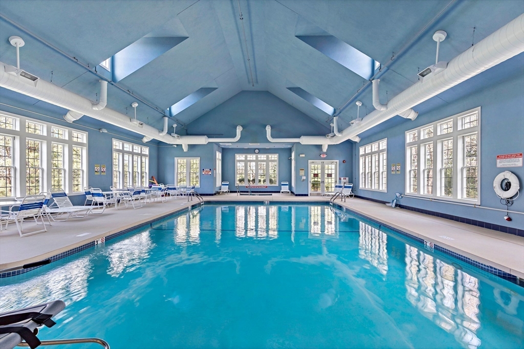 31 Fox Hollow Plymouth, MA 02360 - Photo 34 of 39 a large hall with lots of furniture and a large window