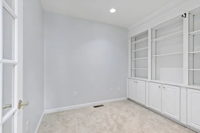 an empty room with shelves