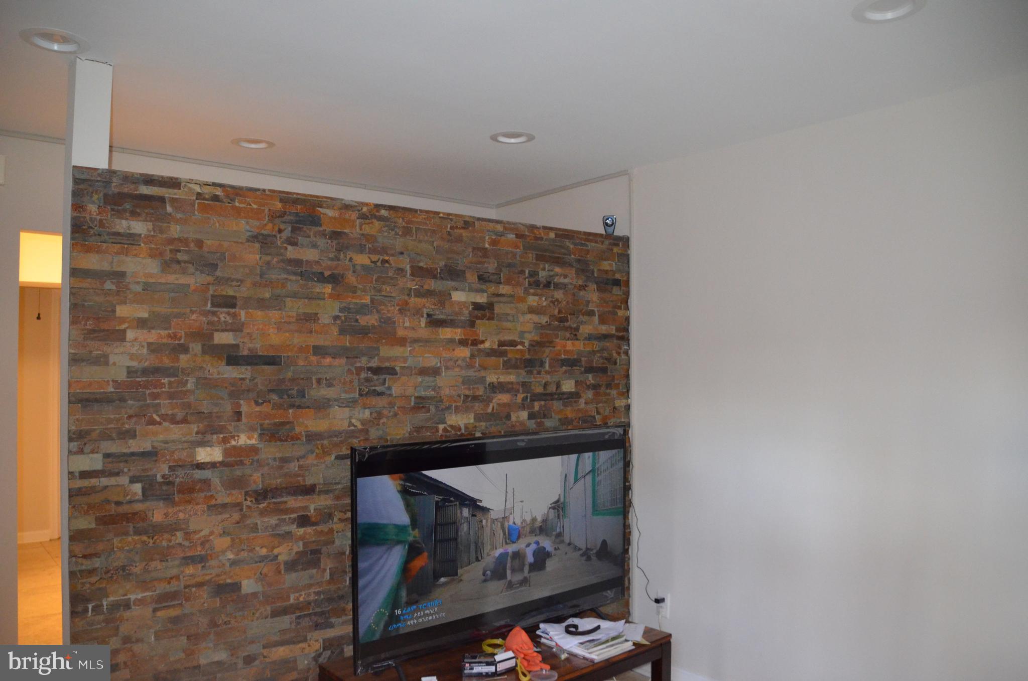 8709 Reading Road Silver Spring, MD 20901 - Photo 4 of 44 a room with a wall