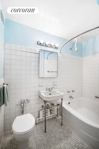 a living room with furniture and a book shelf