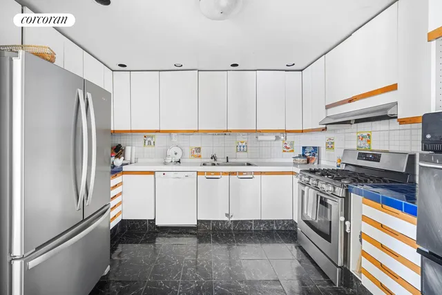 a living room with furniture a chandelier and a flat screen tv