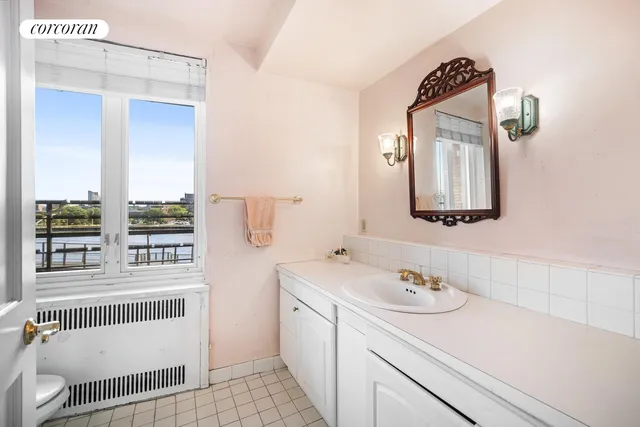 a view of a kitchen with counter top space and windows