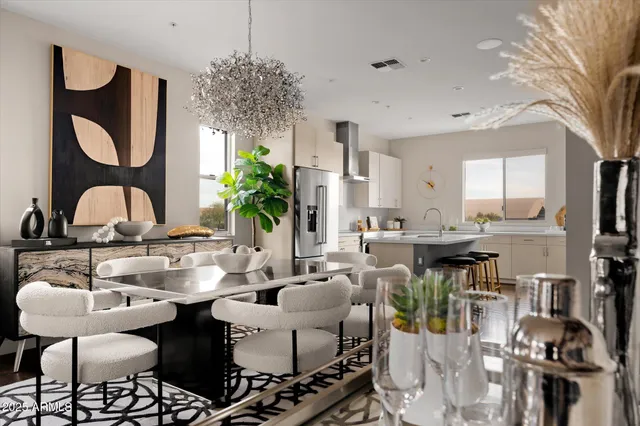 a living room with lots of furniture and a chandelier