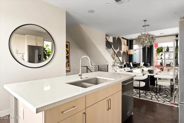 a bathroom with a sink and mirror with toilet