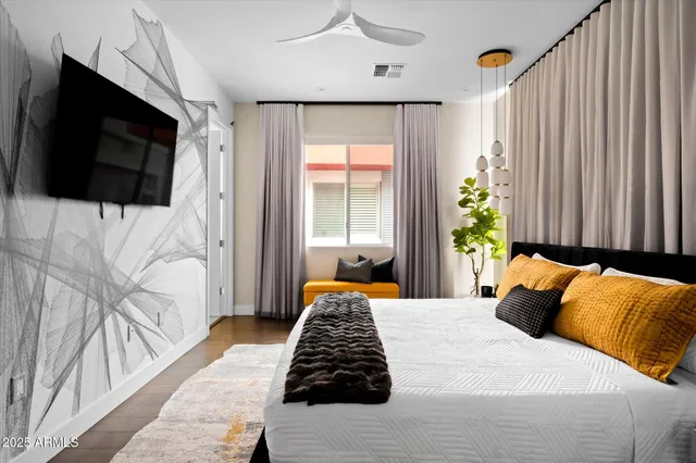 a bedroom with bed and a window