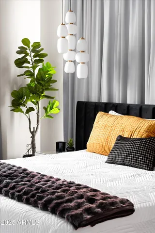 a kitchen with cabinets and wooden floor
