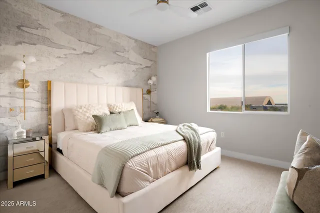 a bedroom with a bed and chandelier