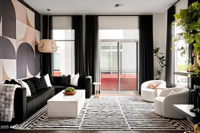 a living room with furniture and a large window