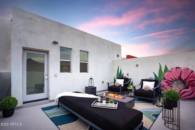 a outdoor living space with furniture and a potted plant