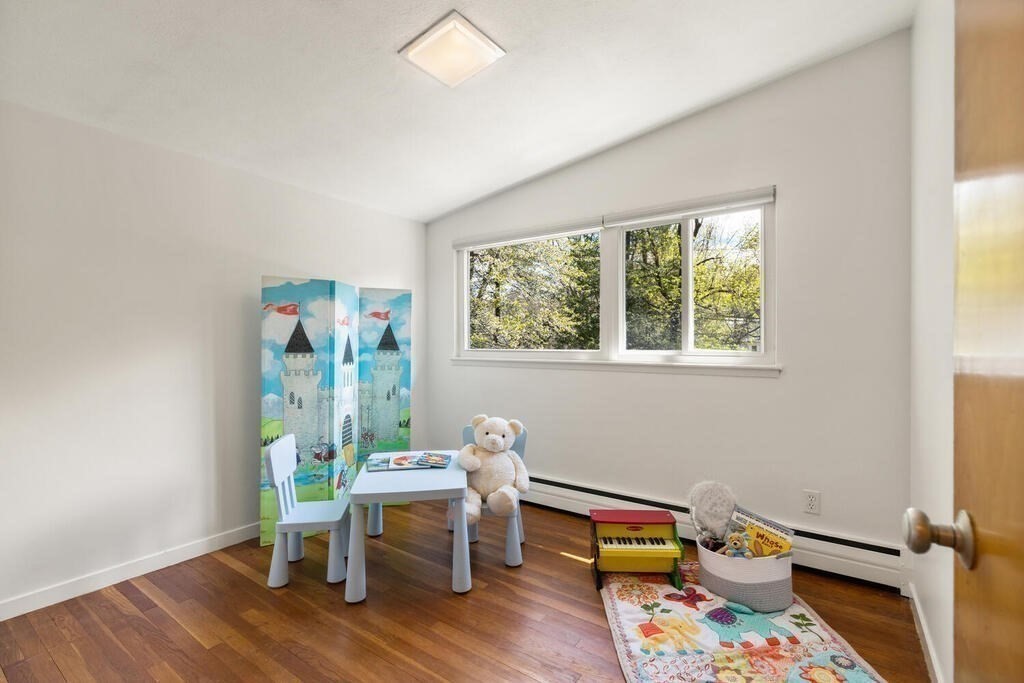 2 Peacock Farm Road Lexington, MA 02421 - Photo 16 of 30 a reading room with furniture wooden floor and a window