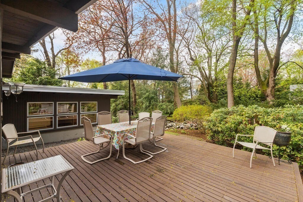 2 Peacock Farm Road Lexington, MA 02421 - Photo 22 of 30 a view of a chair and table on the wooden floor