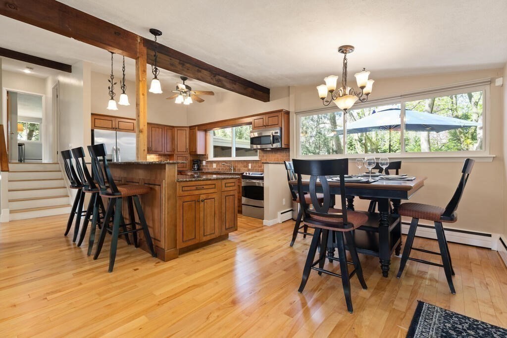 2 Peacock Farm Road Lexington, MA 02421 - Photo 8 of 30 a view of a dining room with furniture wooden floor and chandelier
