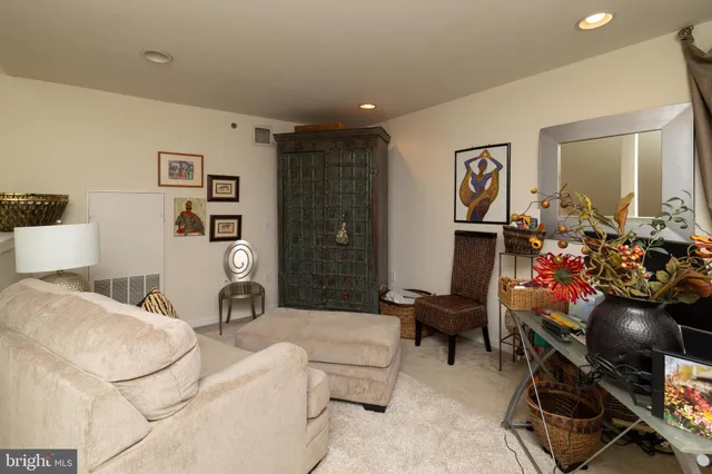 a bathroom with a granite countertop sink mirror and toilet
