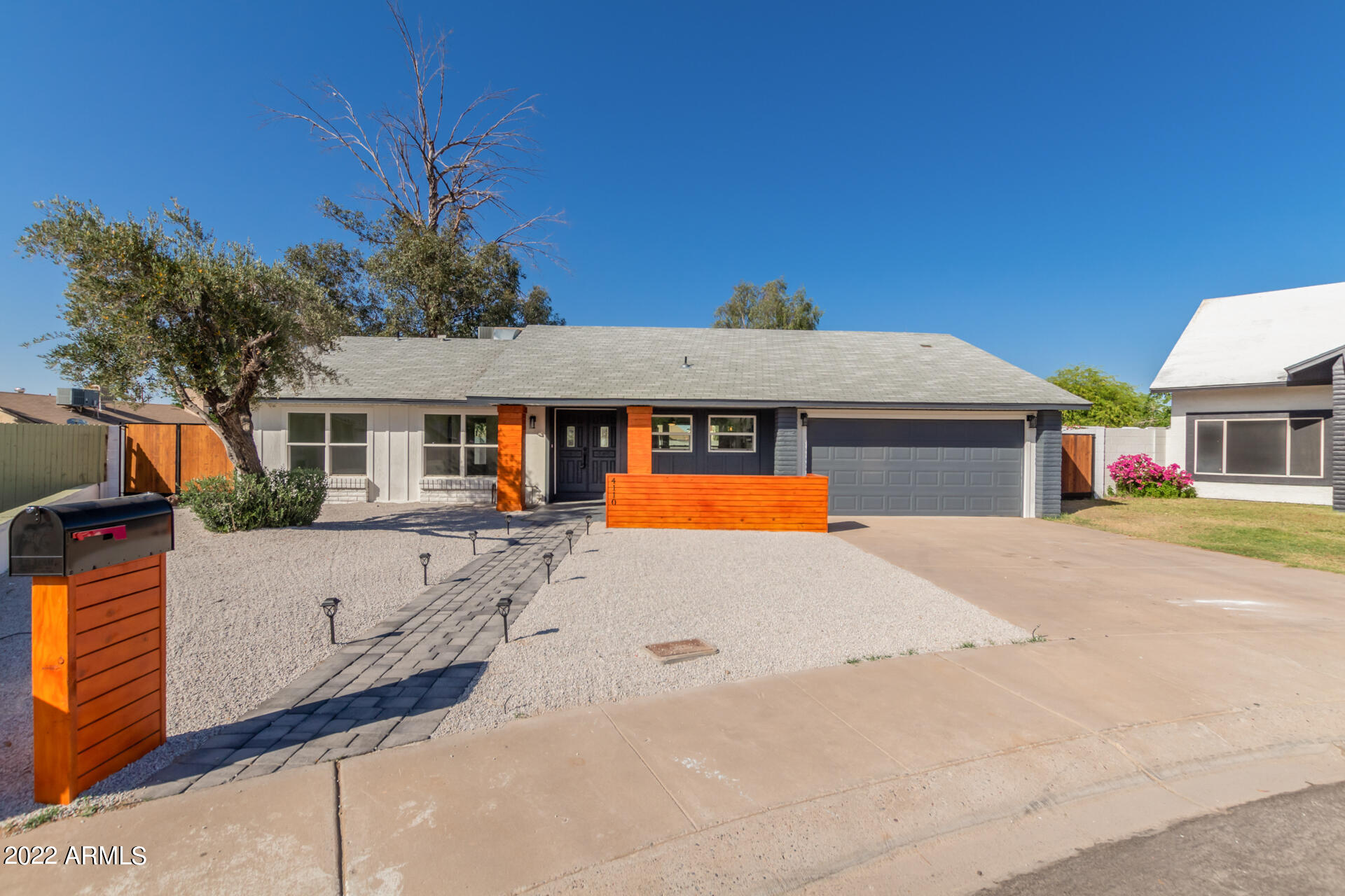 4110 East Vineyard Road Phoenix, AZ 85042 - Photo 1 of 31 a front view of a house with a yard