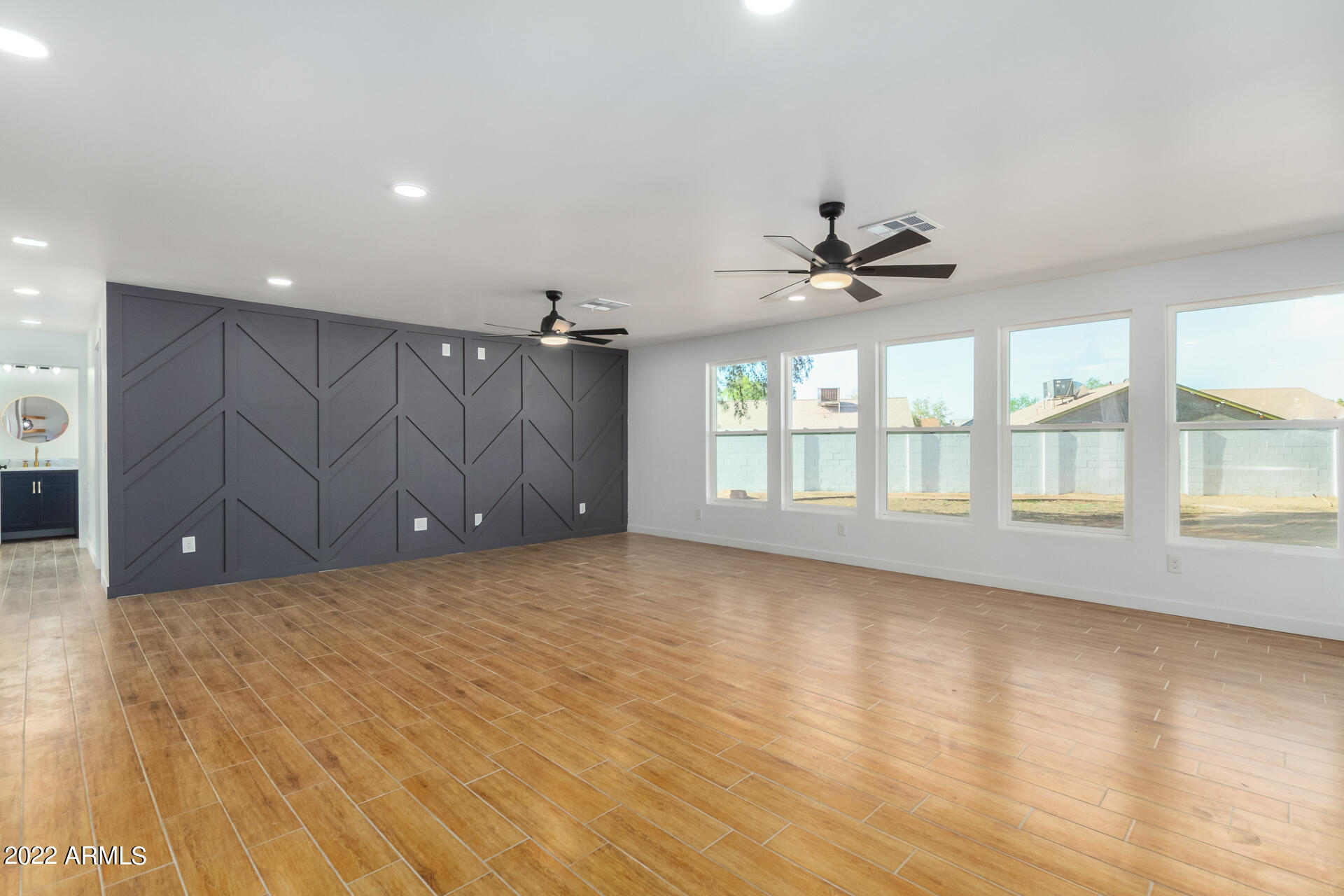 4110 East Vineyard Road Phoenix, AZ 85042 - Photo 12 of 31 a view of an empty room with a window