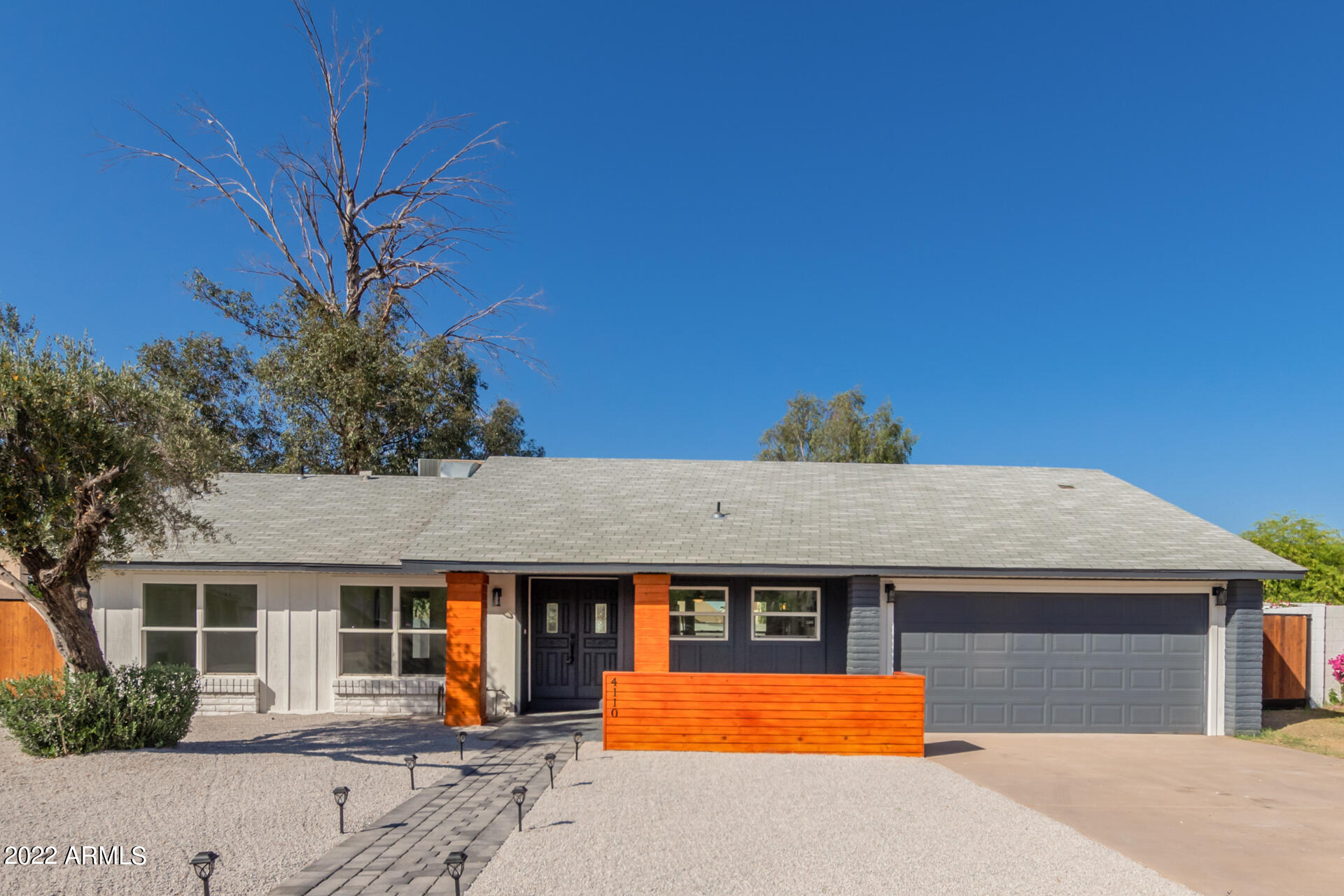 4110 East Vineyard Road Phoenix, AZ 85042 - Photo 2 of 31 a front view of a house with yard