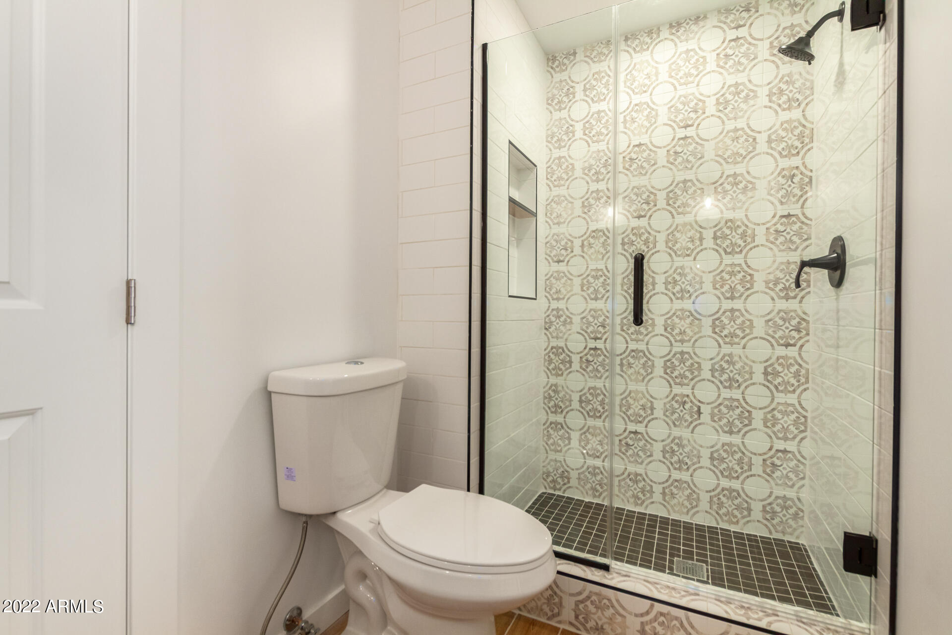 4110 East Vineyard Road Phoenix, AZ 85042 - Photo 21 of 31 a white toilet sitting next to a bathroom sink