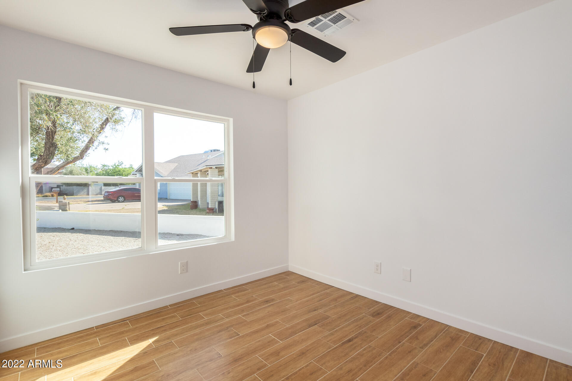 4110 East Vineyard Road Phoenix, AZ 85042 - Photo 24 of 31 a view of an empty room with a window