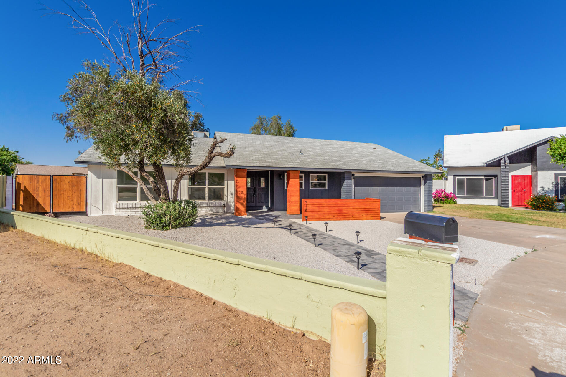 4110 East Vineyard Road Phoenix, AZ 85042 - Photo 3 of 31 a front view of a building with street