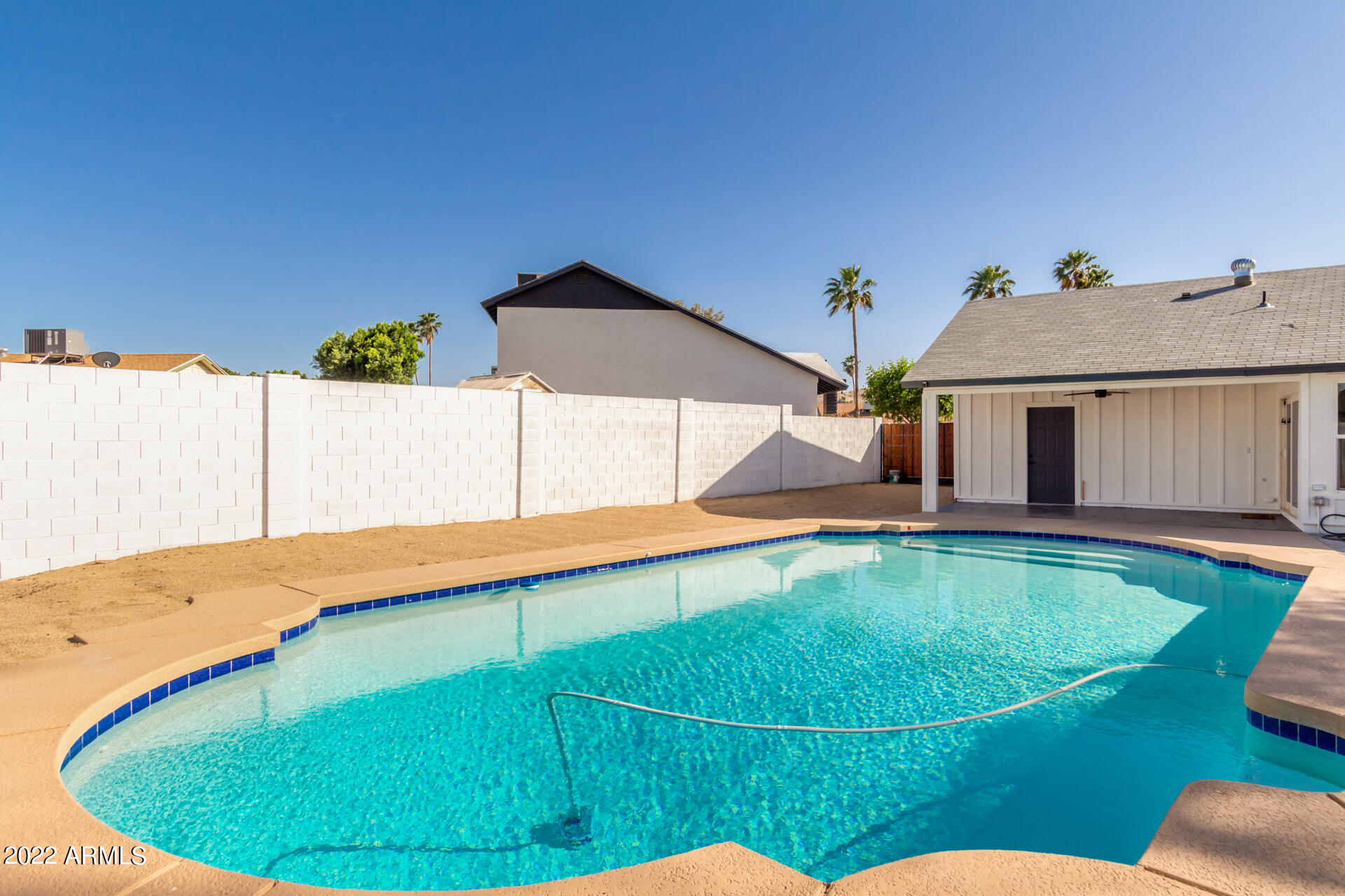 4110 East Vineyard Road Phoenix, AZ 85042 - Photo 31 of 31 a view of a house with swimming pool