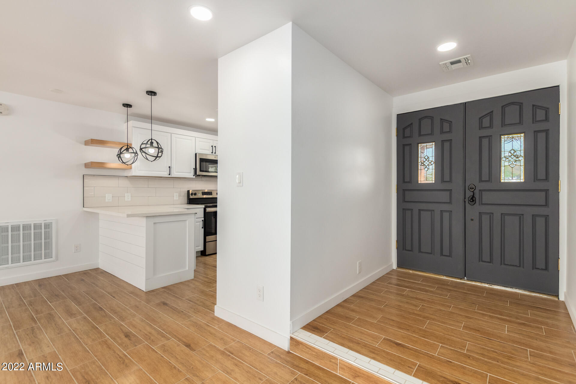4110 East Vineyard Road Phoenix, AZ 85042 - Photo 8 of 31 a view of a kitchen cabinets a sink and wooden floor