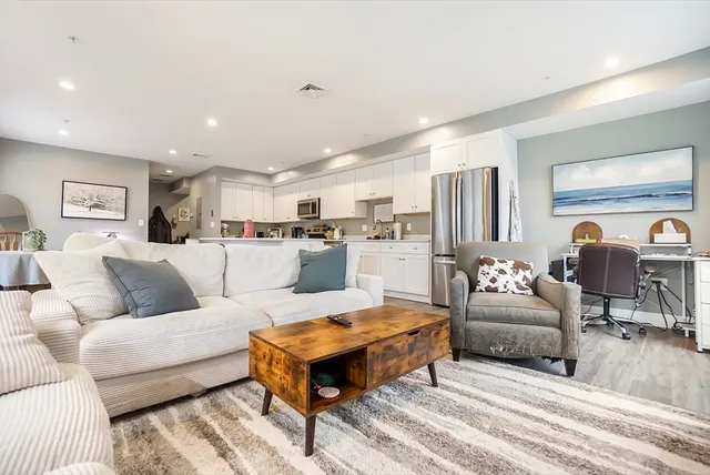 a living room with furniture and a table