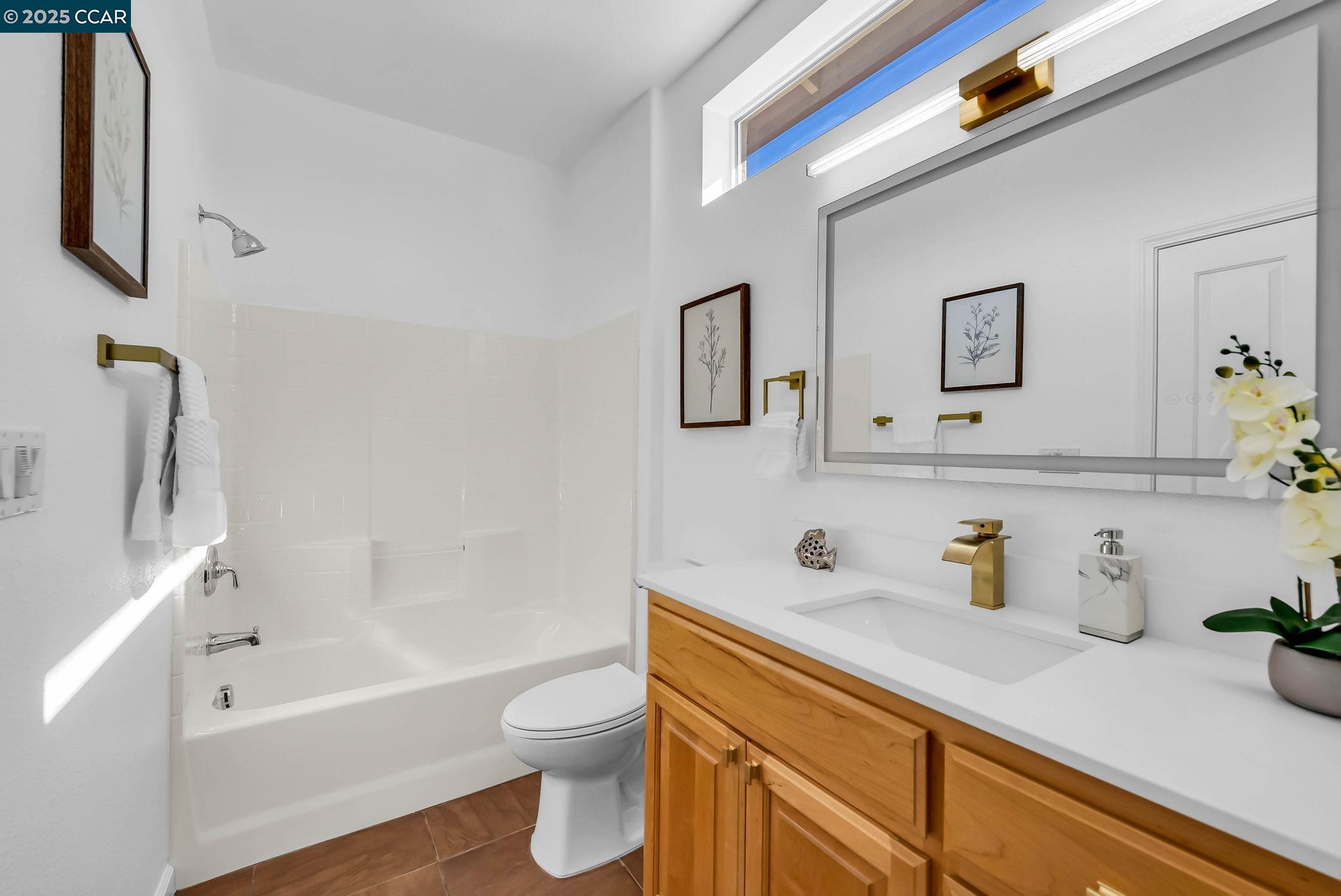 900 Brookside Lane Rio Vista, CA 94571 - Photo 13 of 60 a bathroom with a sink a toilet and a bathtub