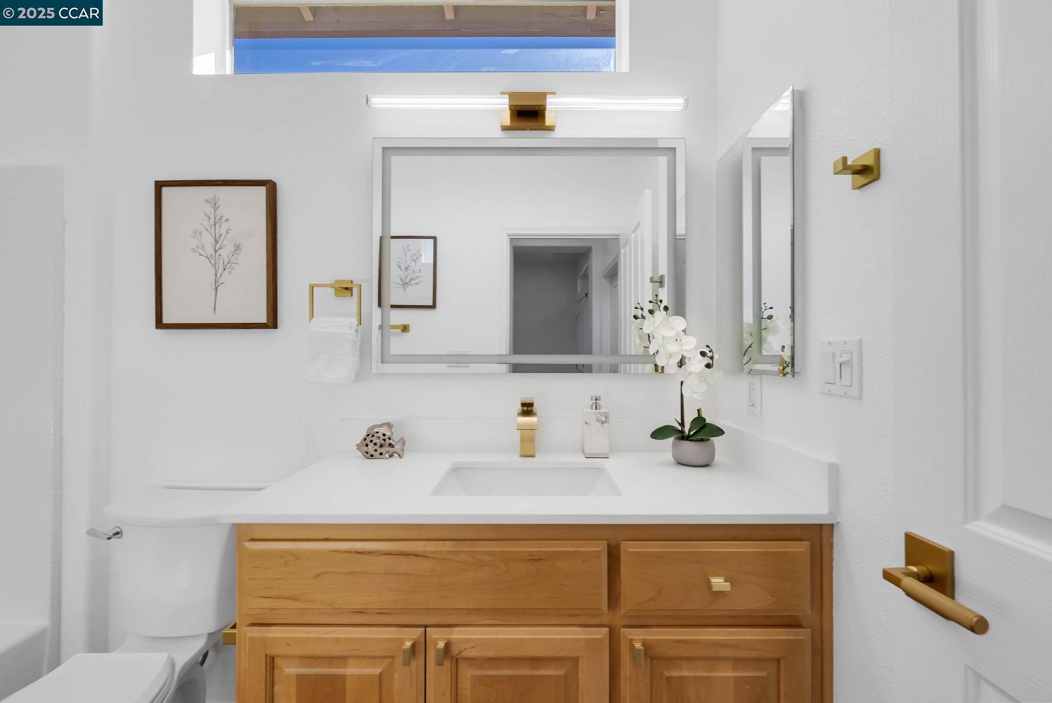 900 Brookside Lane Rio Vista, CA 94571 - Photo 14 of 60 a bathroom with a sink and a mirror