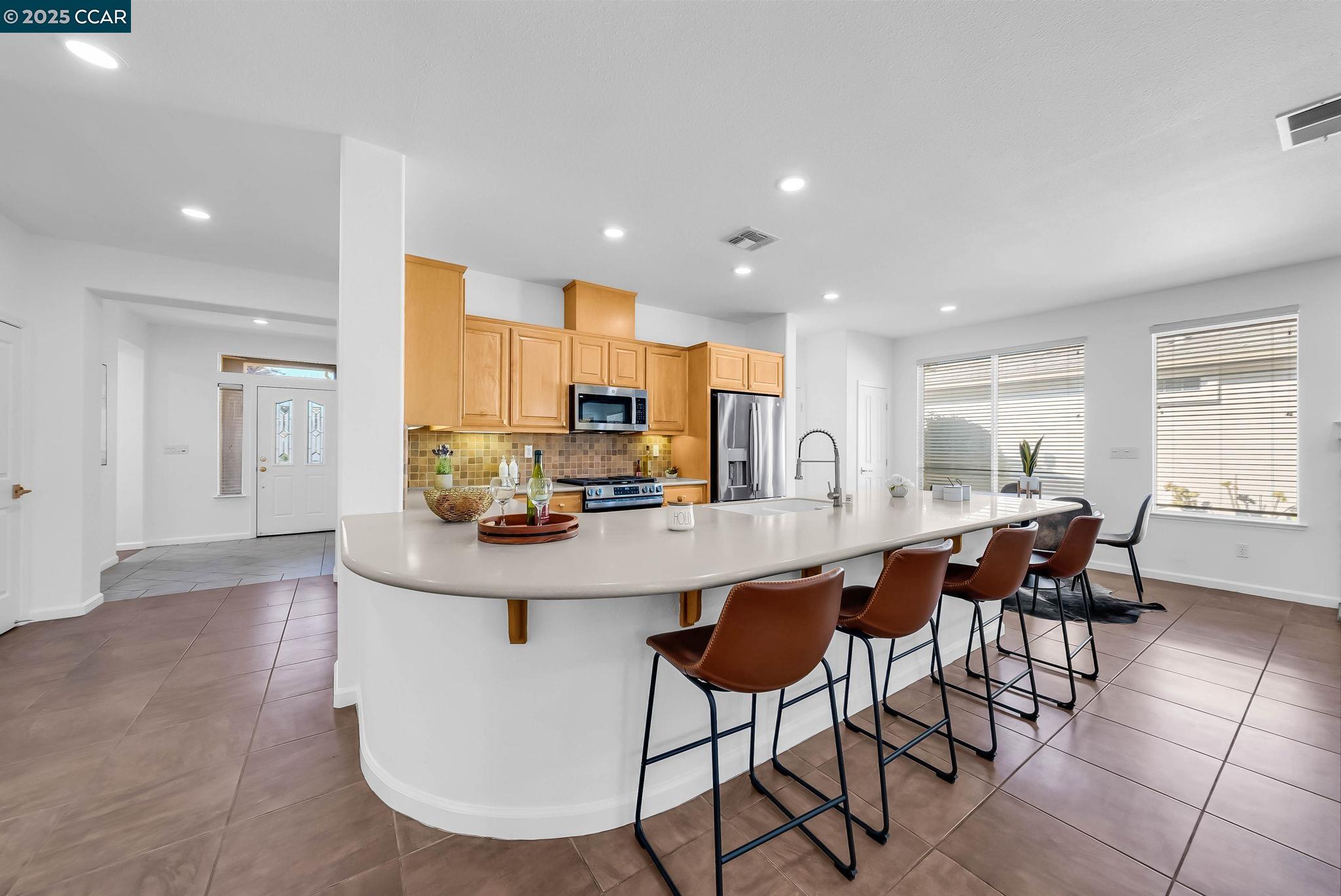 900 Brookside Lane Rio Vista, CA 94571 - Photo 19 of 60 a kitchen with stainless steel appliances kitchen island granite countertop a sink and cabinets