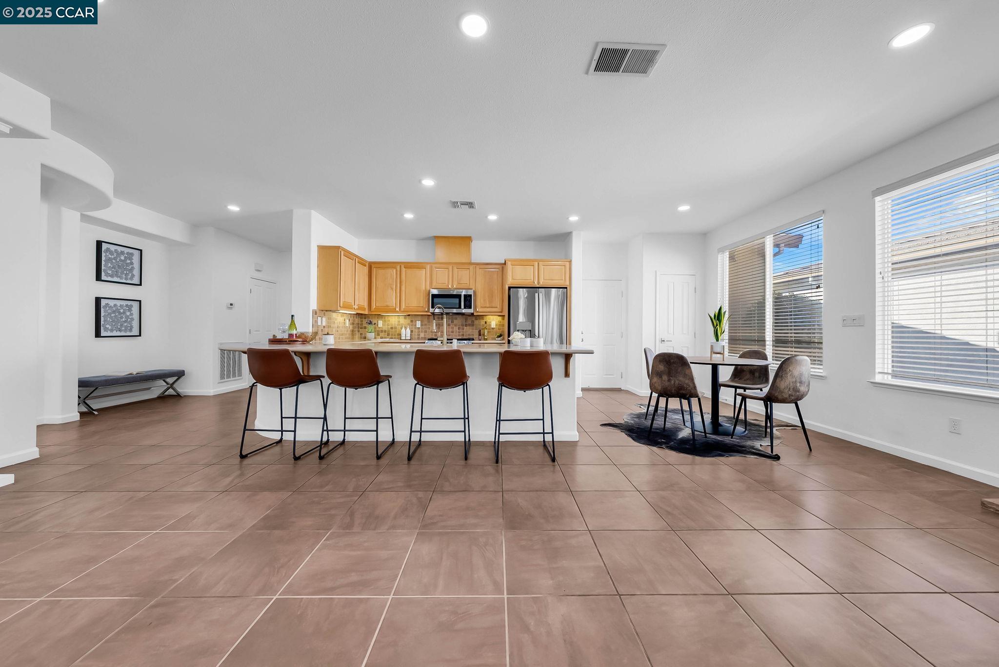 900 Brookside Lane Rio Vista, CA 94571 - Photo 23 of 60 a living room with furniture a dining table and kitchen view