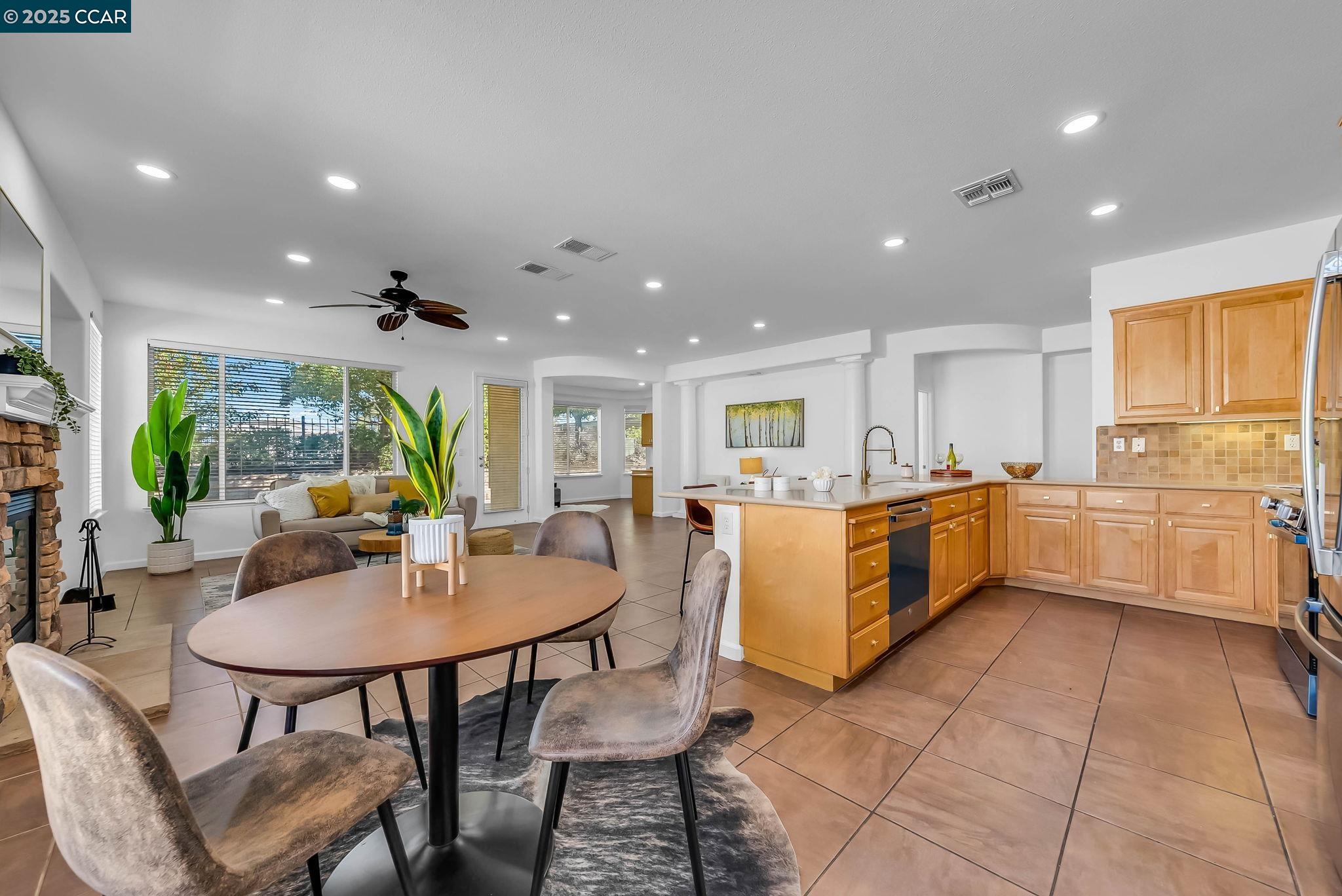 900 Brookside Lane Rio Vista, CA 94571 - Photo 29 of 60 a kitchen with a dining table cabinets and stainless steel appliances