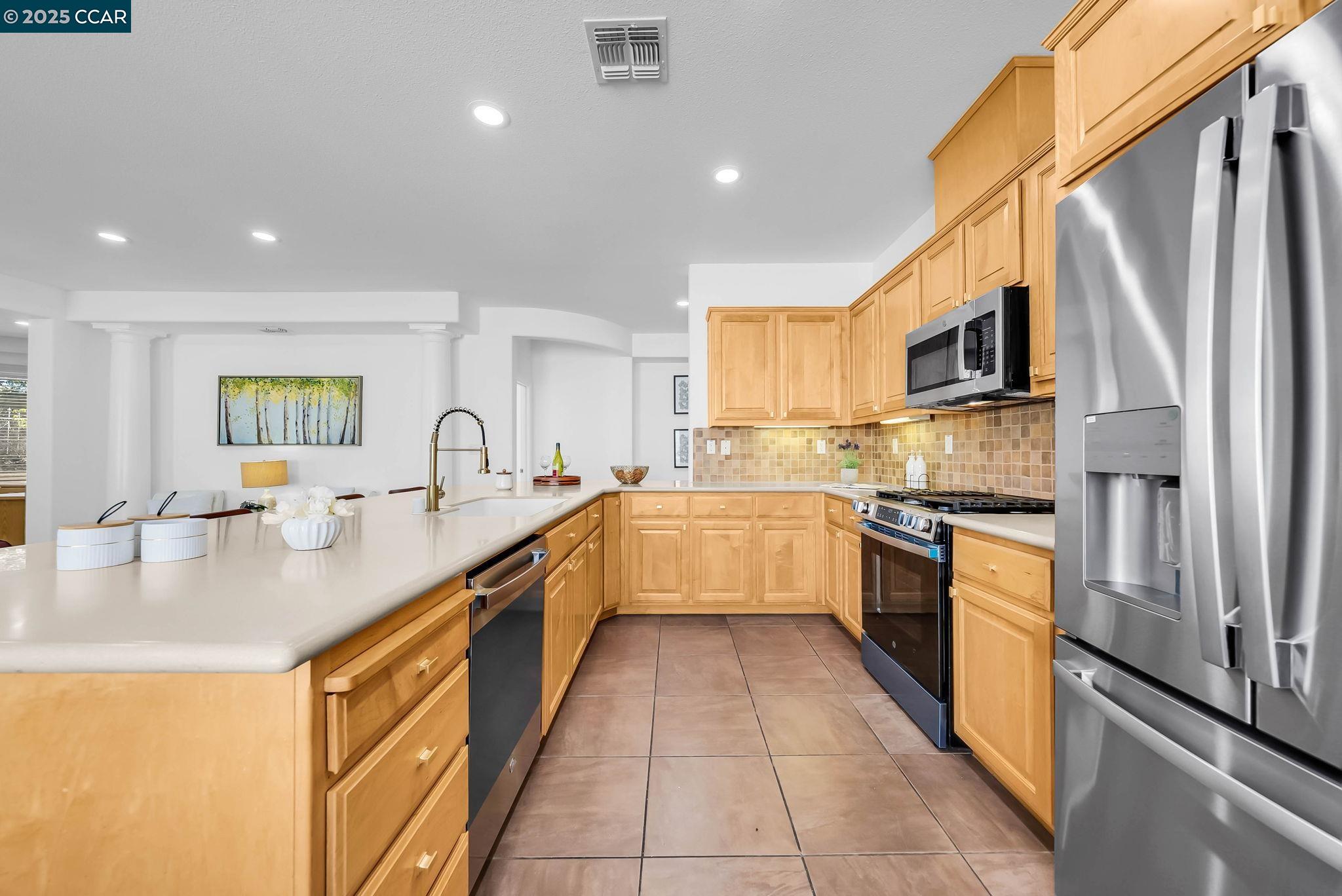 900 Brookside Lane Rio Vista, CA 94571 - Photo 30 of 60 a large kitchen with stainless steel appliances granite countertop a sink a stove and a refrigerator