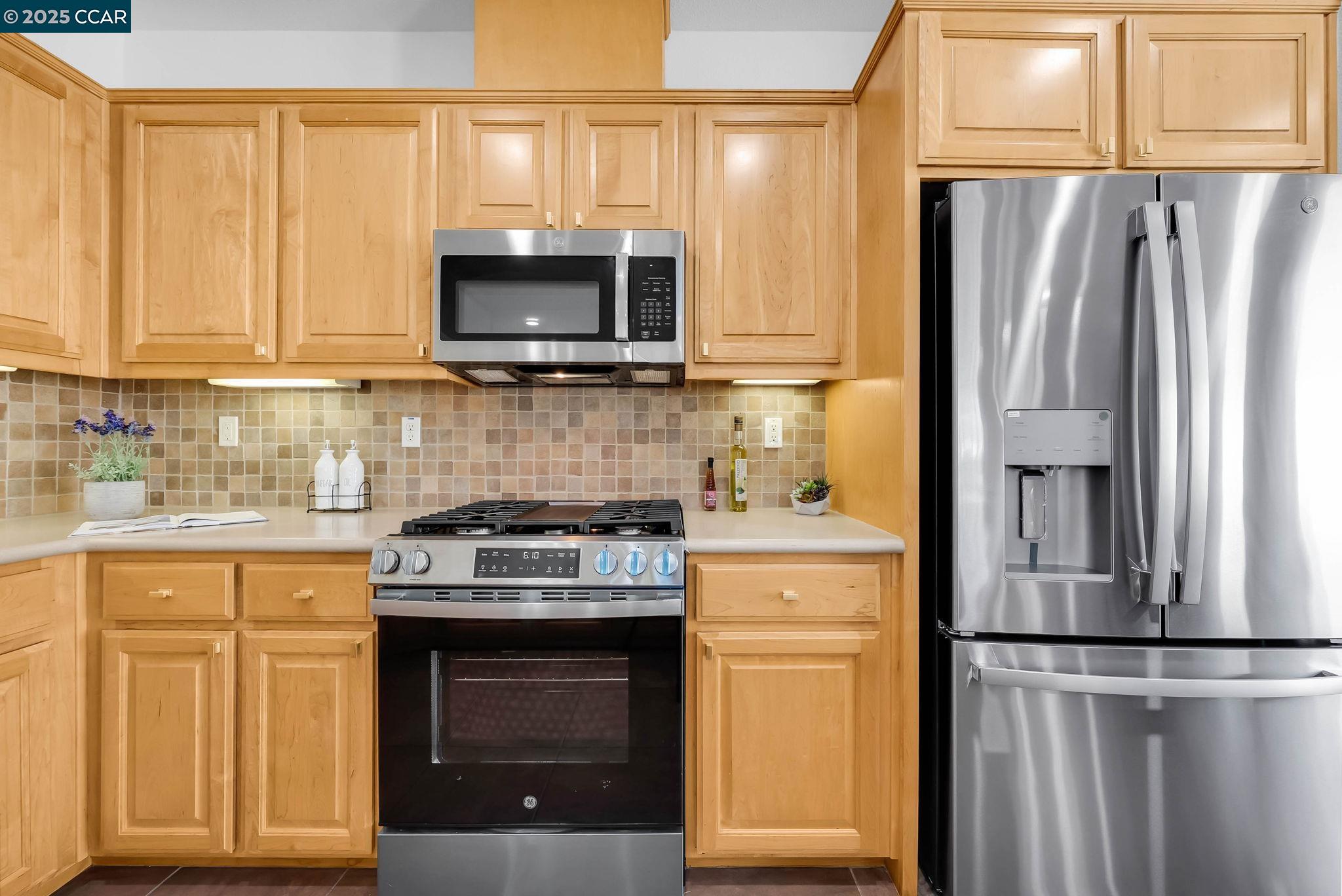 900 Brookside Lane Rio Vista, CA 94571 - Photo 31 of 60 a kitchen with a refrigerator stove and microwave