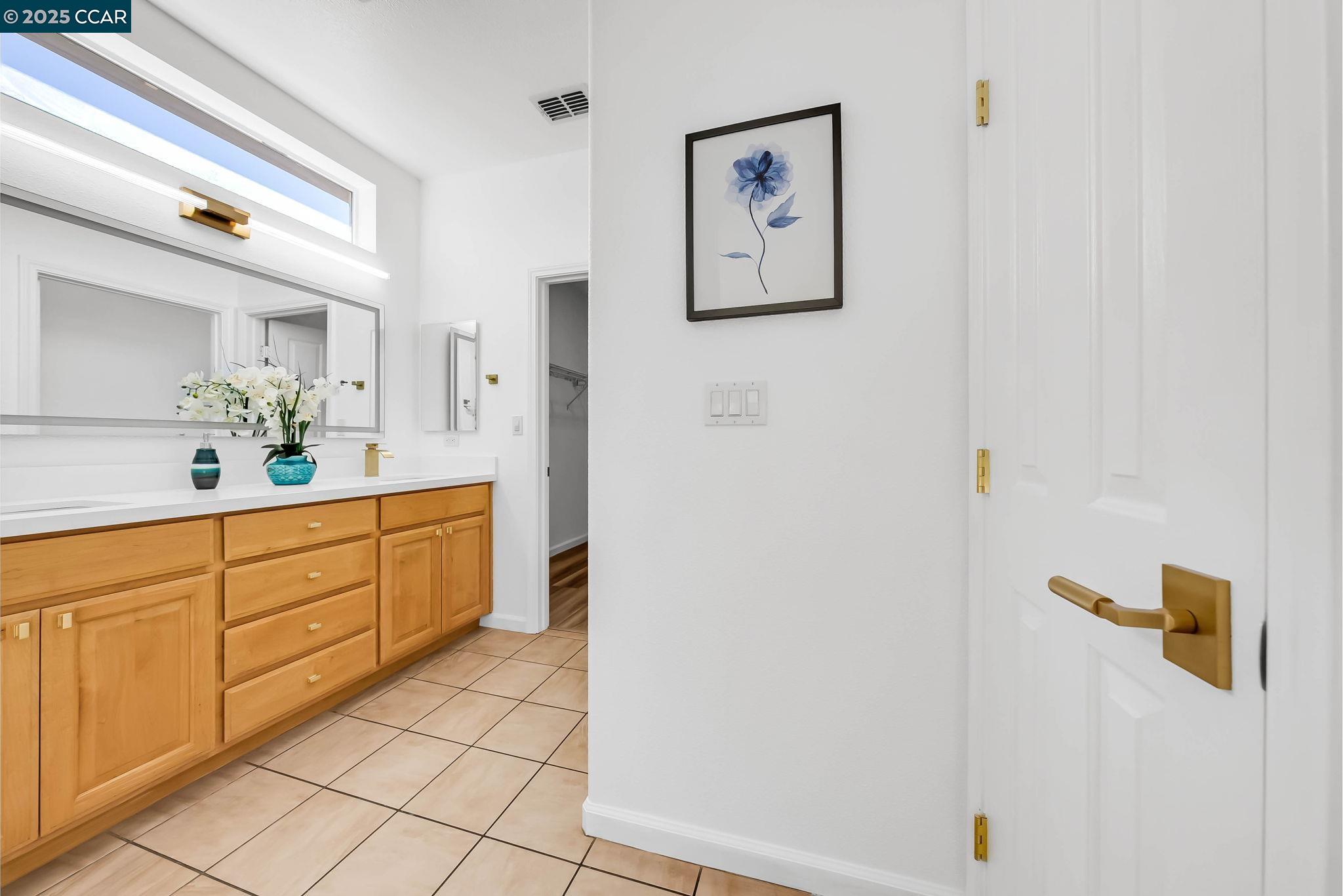900 Brookside Lane Rio Vista, CA 94571 - Photo 39 of 60 a spacious bathroom with a double vanity sink and a mirror