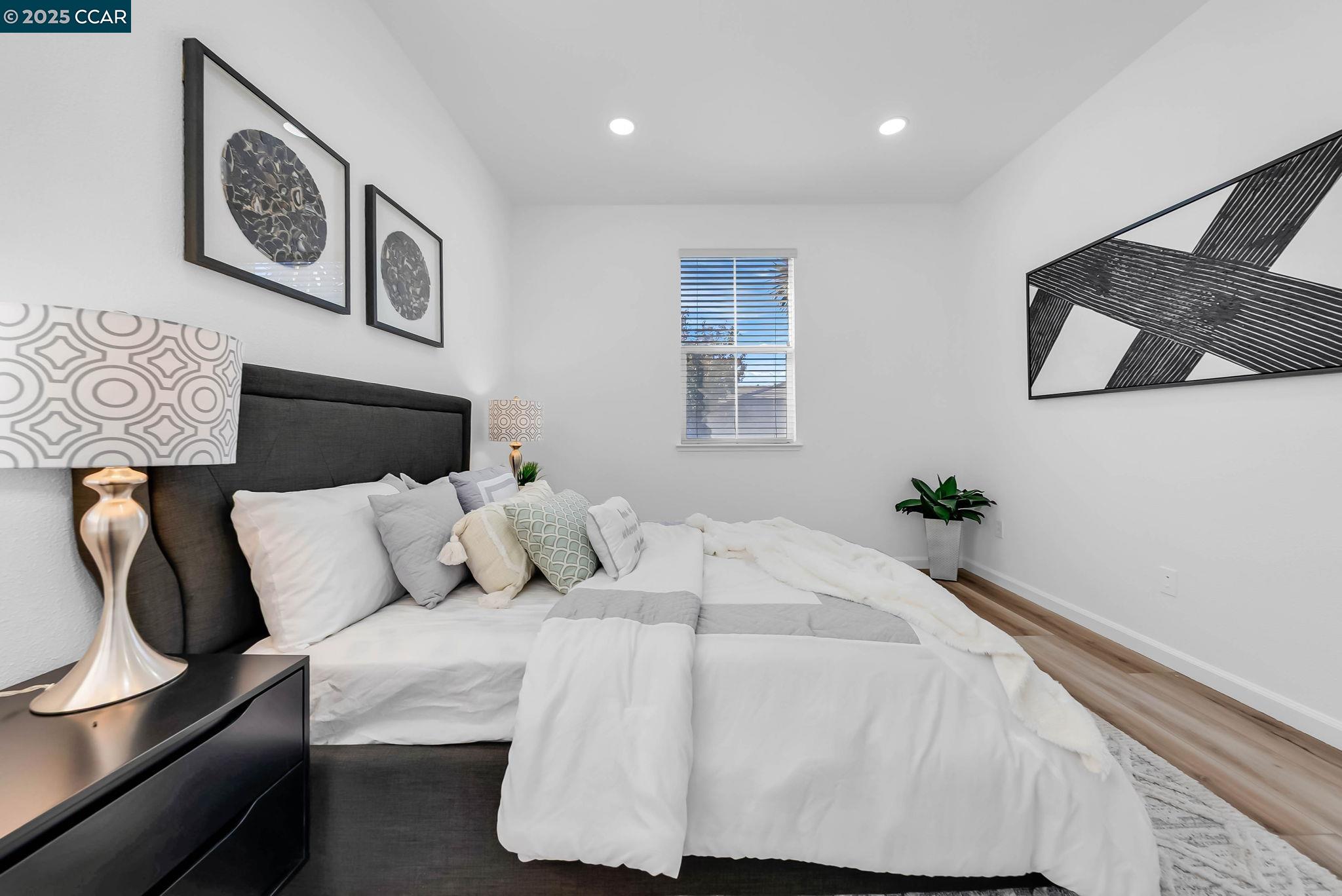 900 Brookside Lane Rio Vista, CA 94571 - Photo 10 of 60 a bedroom with a bed and wall painting