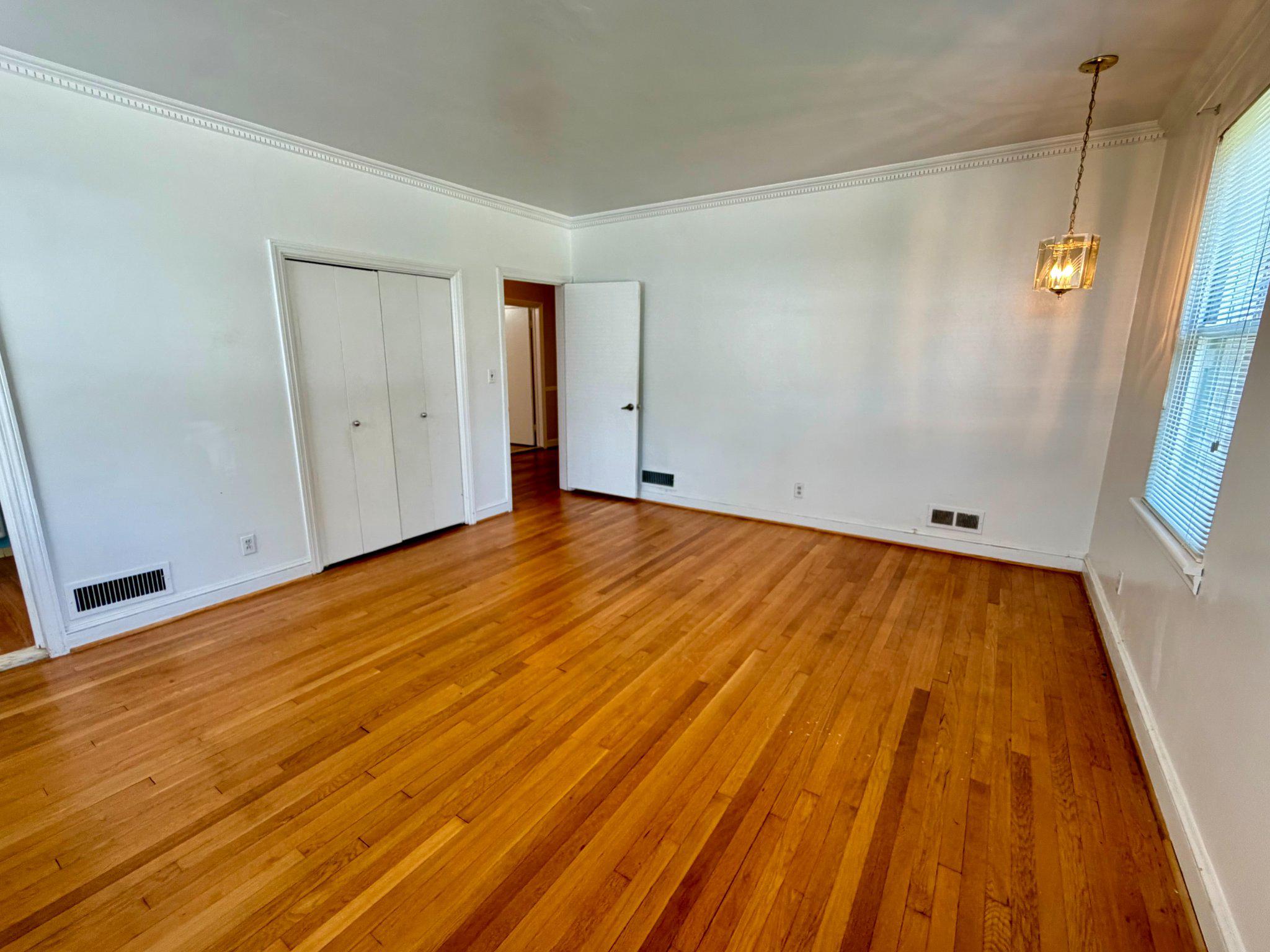 6318 Winner Avenue Baltimore, MD 21215 - Photo 39 of 75 Spacious Master bedroom with warm wood floors.