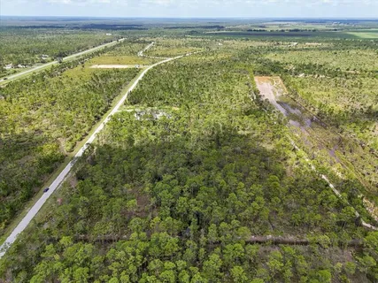 a view of a field with an ocean view