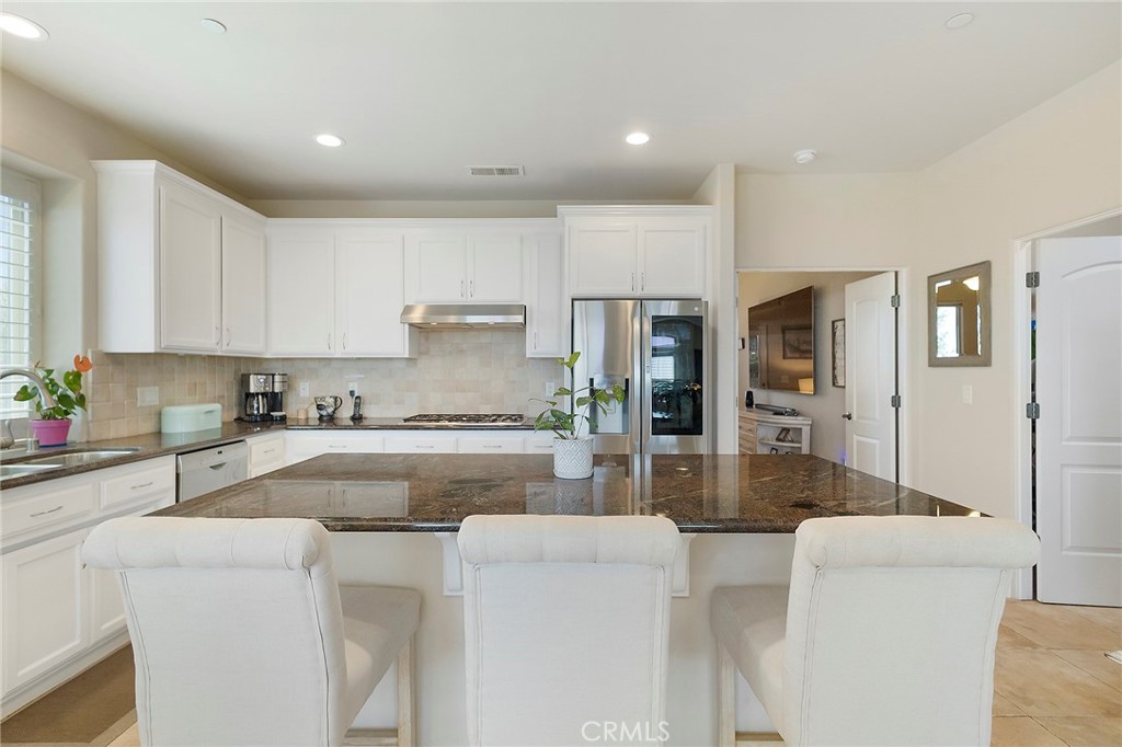 3294 Summit Ridge Terrace Chico, CA 95928 - Photo 16 of 68 a kitchen with stainless steel appliances granite countertop a refrigerator and a stove top oven