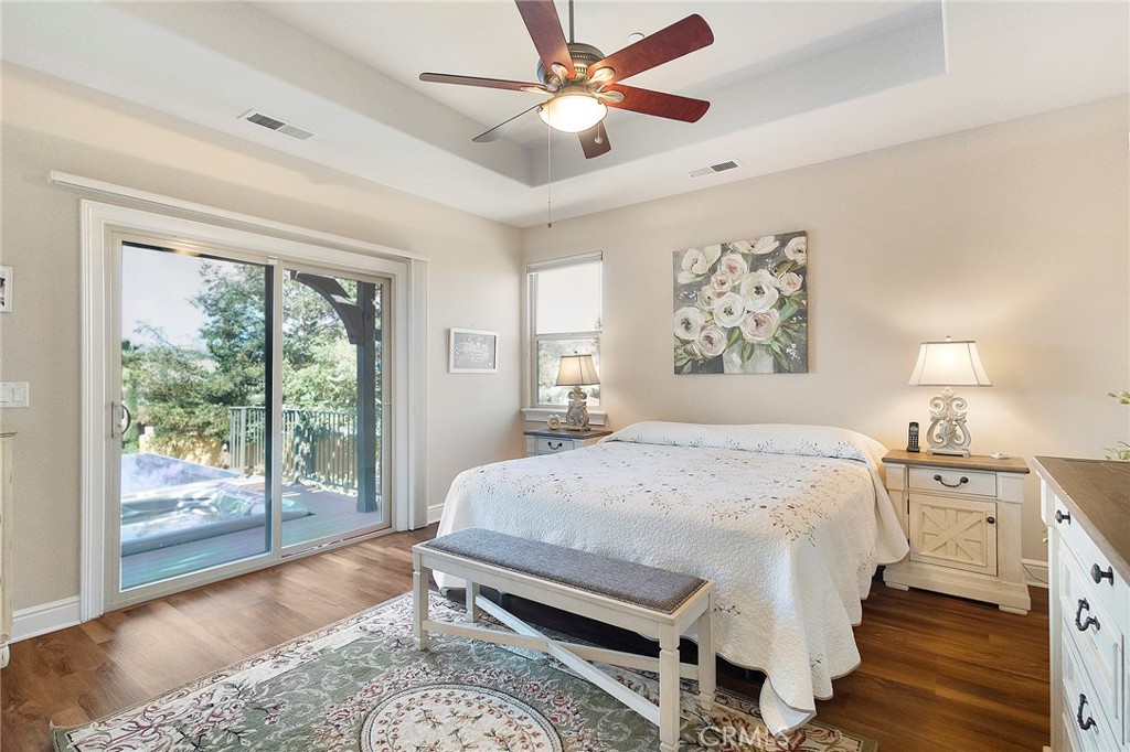 3294 Summit Ridge Terrace Chico, CA 95928 - Photo 25 of 68 a bedroom with a bed and wooden floor