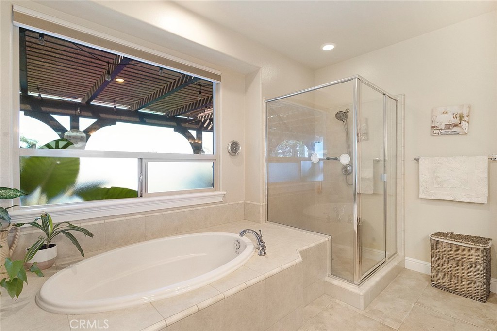3294 Summit Ridge Terrace Chico, CA 95928 - Photo 31 of 68 a bathroom with a tub a sink and a window
