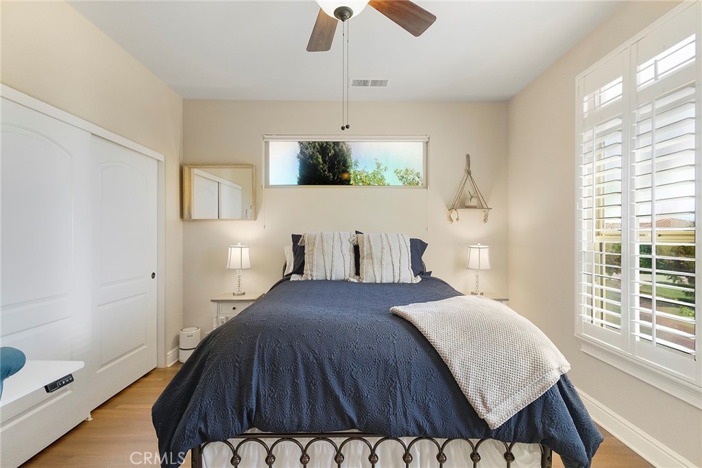 3294 Summit Ridge Terrace Chico, CA 95928 - Photo 33 of 68 a bedroom with a bed and a chandelier