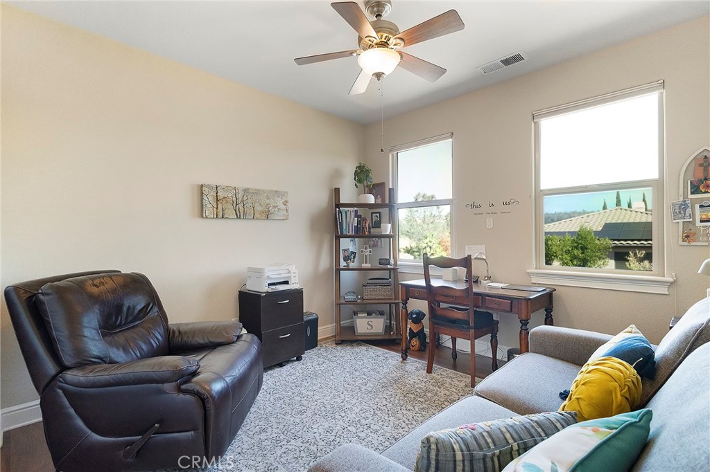 3294 Summit Ridge Terrace Chico, CA 95928 - Photo 36 of 68 a living room with furniture ceiling fan and a window