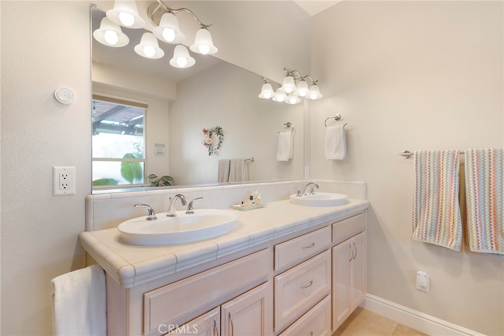 3294 Summit Ridge Terrace Chico, CA 95928 - Photo 39 of 68 a bathroom with a sink vanity and a mirror
